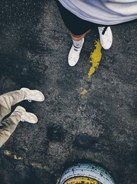 Low section of person standing on street