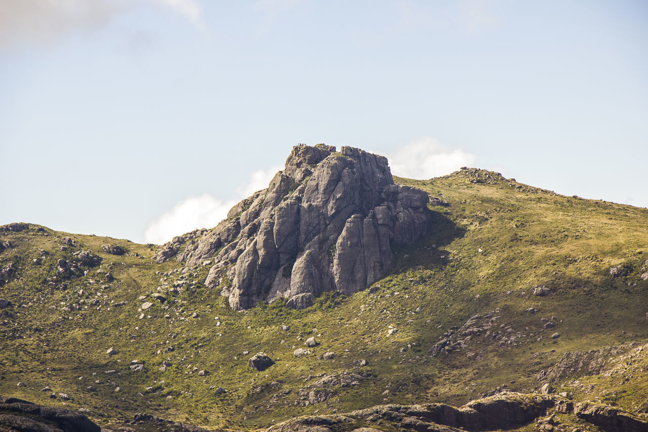 LOW ANGLE VIEW OF ROCK FORMATIONS AGAINST SKY