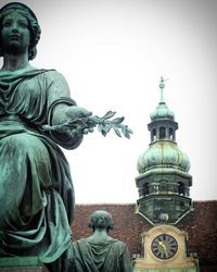 Low angle view of statue against sky