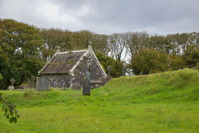 House on field against sky