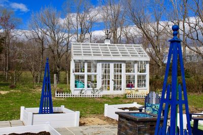 Built structure on field against trees in park