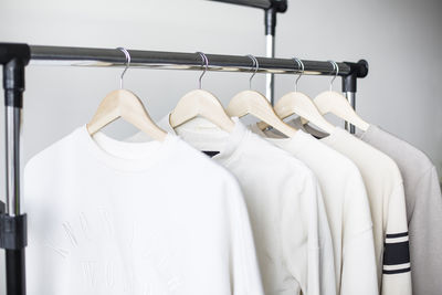 Close-up of clothes hanging on rack