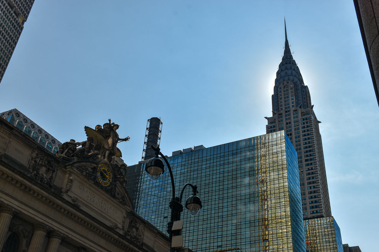 LOW ANGLE VIEW OF BUILDINGS IN CITY AGAINST SKY