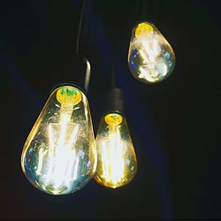 Close-up of light bulb at night