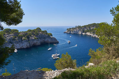 High angle view of sea against clear blue sky