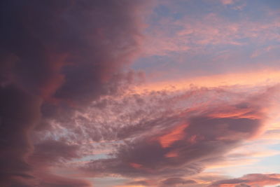 Low angle view of dramatic sky during sunset