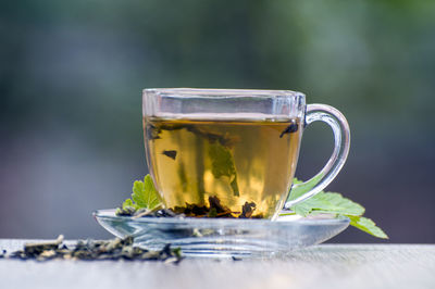 Close-up of tea in glass on table