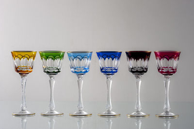 Close-up of wine glasses on table