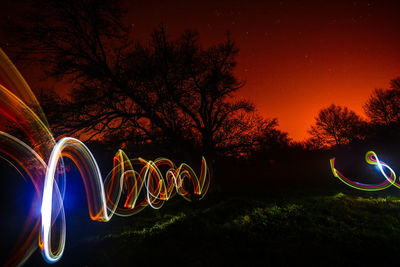 View of illuminated street lights at night