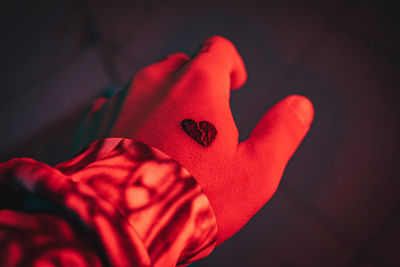 Close-up of hand with broken heart