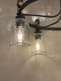 Illuminated light bulb hanging on table