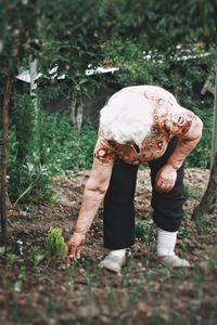 Rear view of man standing on field