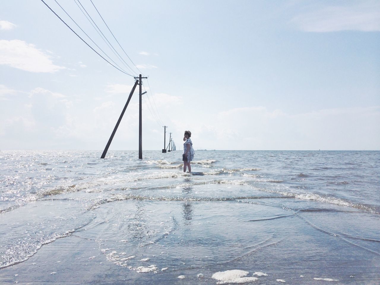 sea, water, leisure activity, horizon over water, lifestyles, sky, full length, men, fishing rod, fishing, rear view, standing, tranquility, scenics, nature, tranquil scene, vacations, beach