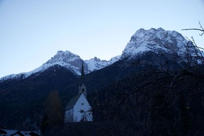 Scenic view of snowcapped mountains against clear sky