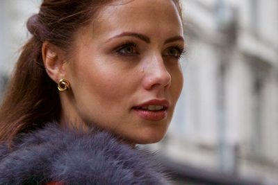 Close-up of young woman looking away