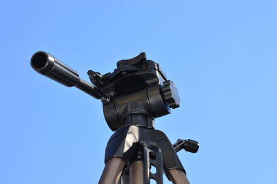 A tripod in the blue sky