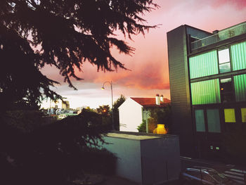 Low angle view of building against sky at sunset
