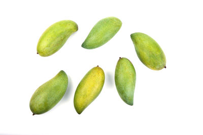 High angle view of fruits over white background