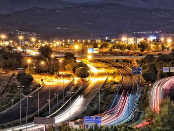 High angle view of light trails on highway at night