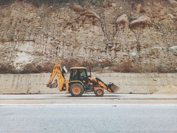 Side view of a horse cart on road