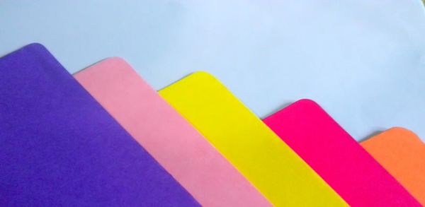 High angle view of colorful papers on table