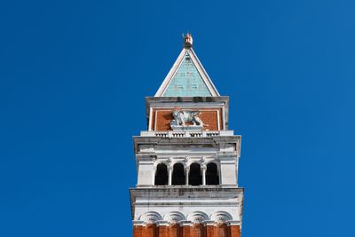 Low angle view of a building against blue sky