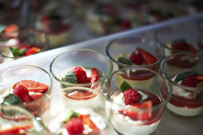 Close-up of strawberries in glass on table