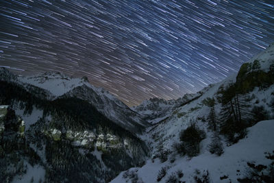 Scenic view of mountains against sky at night