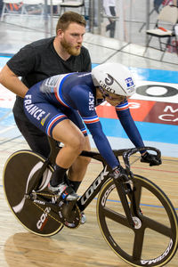 Young man riding bicycle