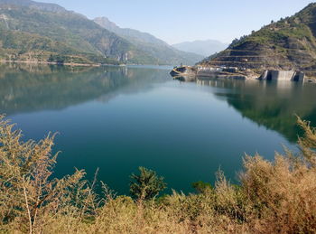 Scenic view of lake with mountains in background