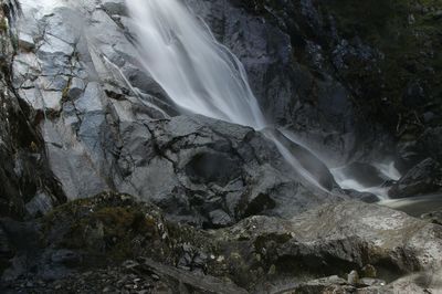 Close-up of waterfall against mountain