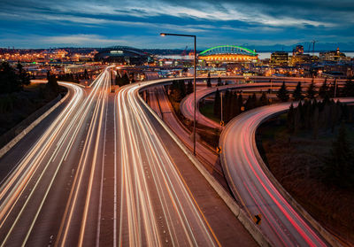 Light trails on road in city at night