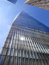 Low angle view of skyscraper against sky