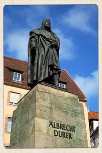 Low angle view of statue against sky