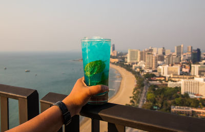 A blue mojito cocktail at a rooftop bar in thailand southeast asia