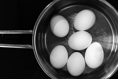 Directly above shot of eggs in cooking utensil