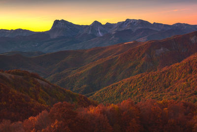 Scenic view of mountains at sunset