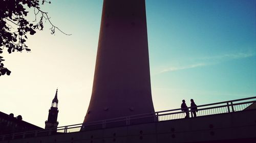 Low angle view of woman against clear sky