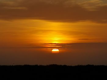 Scenic view of silhouette landscape against romantic sky at sunset