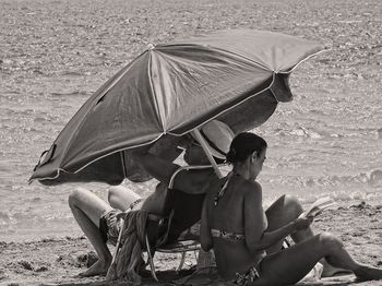 High angle view of people relaxing on beach