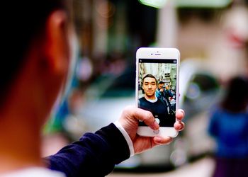 Woman photographing through smart phone