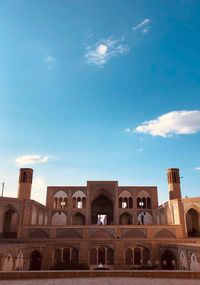 Low angle view of historical building against blue sky