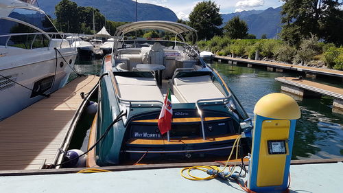 View of boats moored in river