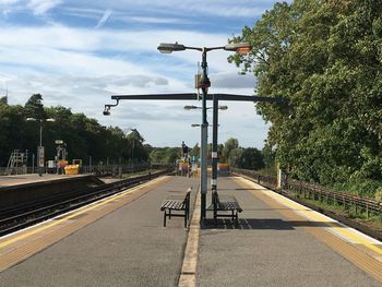 Railroad station platform against sky