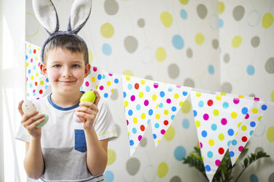 Portrait of cute boy playing on table