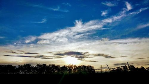 Silhouette of trees against sky during sunset