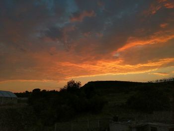 Scenic view of silhouette landscape against sky during sunset