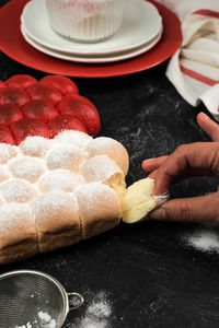 Female hand pull bubble chigiri bread showing nice texture of hokkaido milk bread