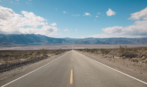 Road amidst landscape against sky