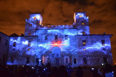 Crowd of illuminated historic building at night